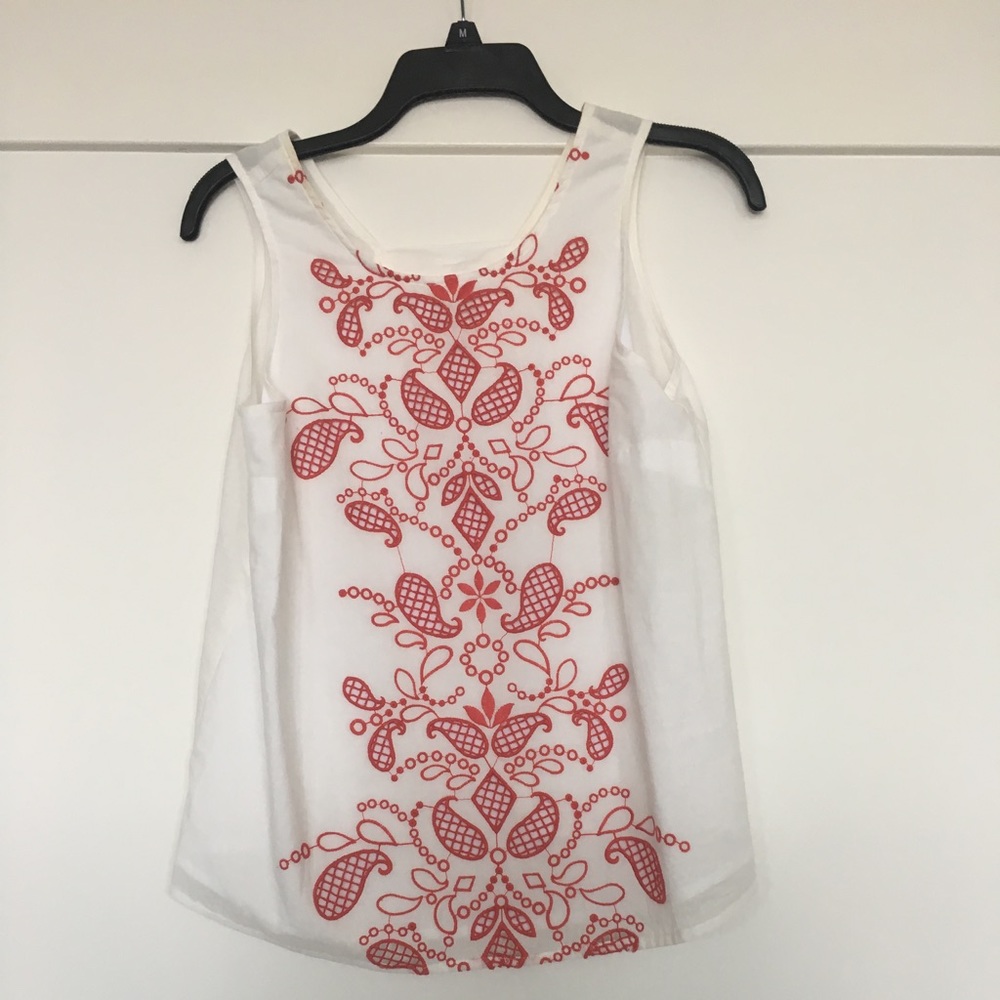 White top with red details